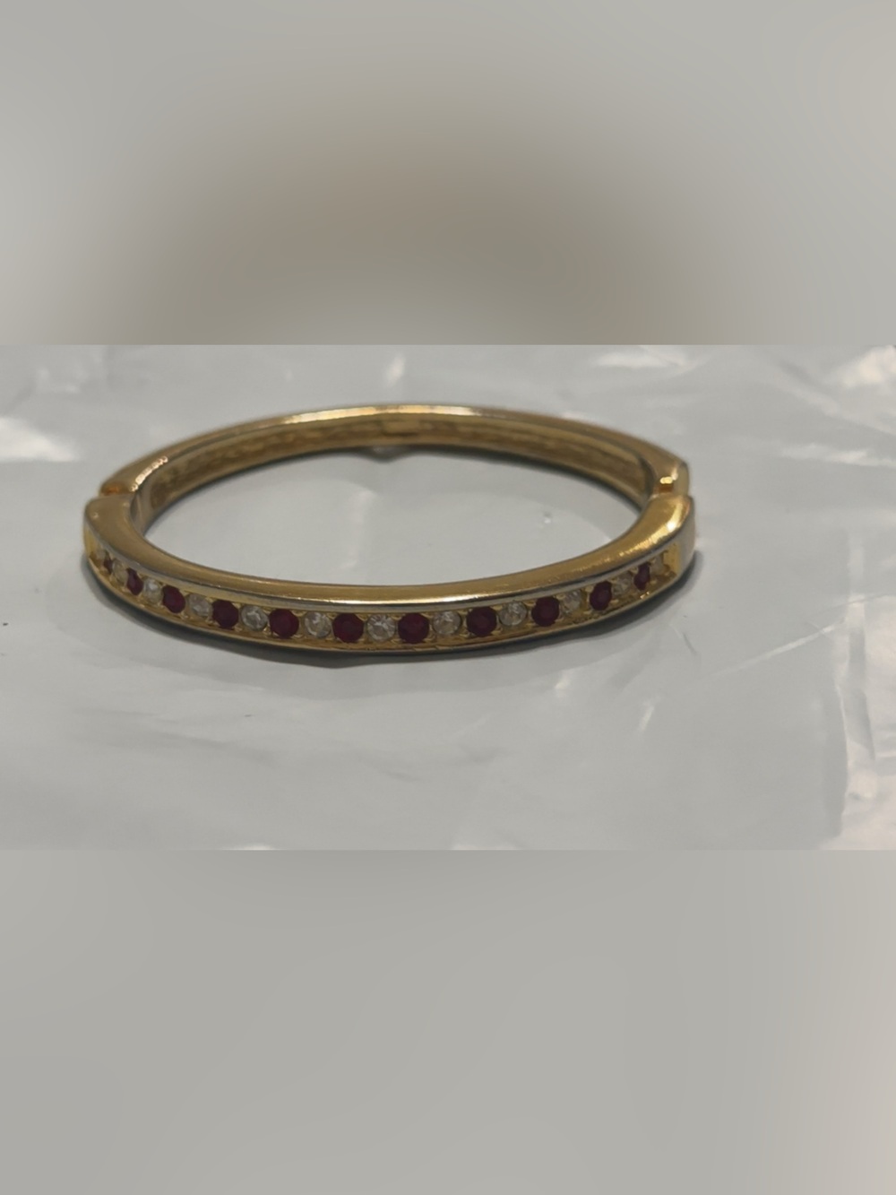 Gold Tone Women’s Ring with Red Gemstone Accents